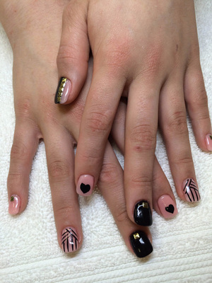 Crossed female hands with 3 different nail designs are a trending look at Binh's Nail Salon