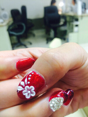 Sparkling gems and carefully detailed 3D floral images provide a stunning look from Binh's Nails in South Edmonton