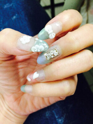 Perflectly manicured nails with 3D floral and heart-shaped elements