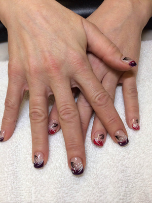 Manicured hands with black, white and pink design features from Binh's