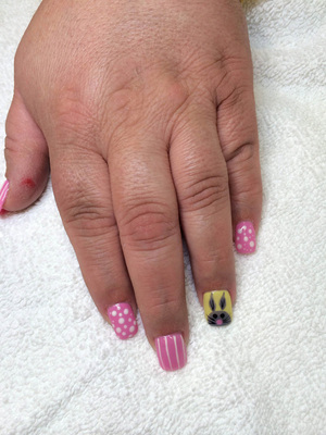 pink polished fingernails with white accents and a cartoon bunny on the ring finger by Binh's 