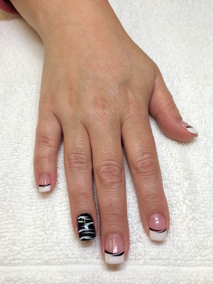 Black and white elements lend an air of class to this stunning manicure from Binh's